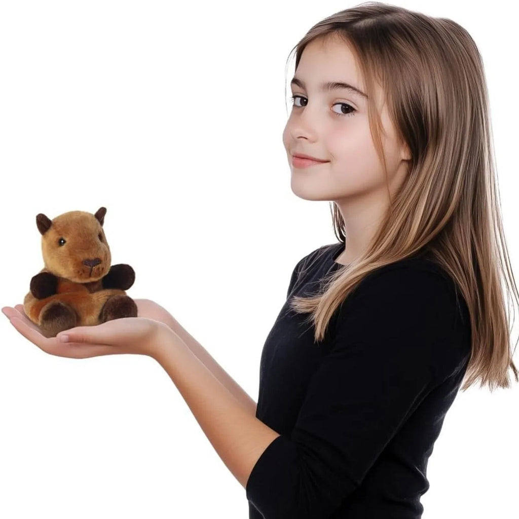 Child holding capybara plush toy in both hands, tan fur, 12 cm