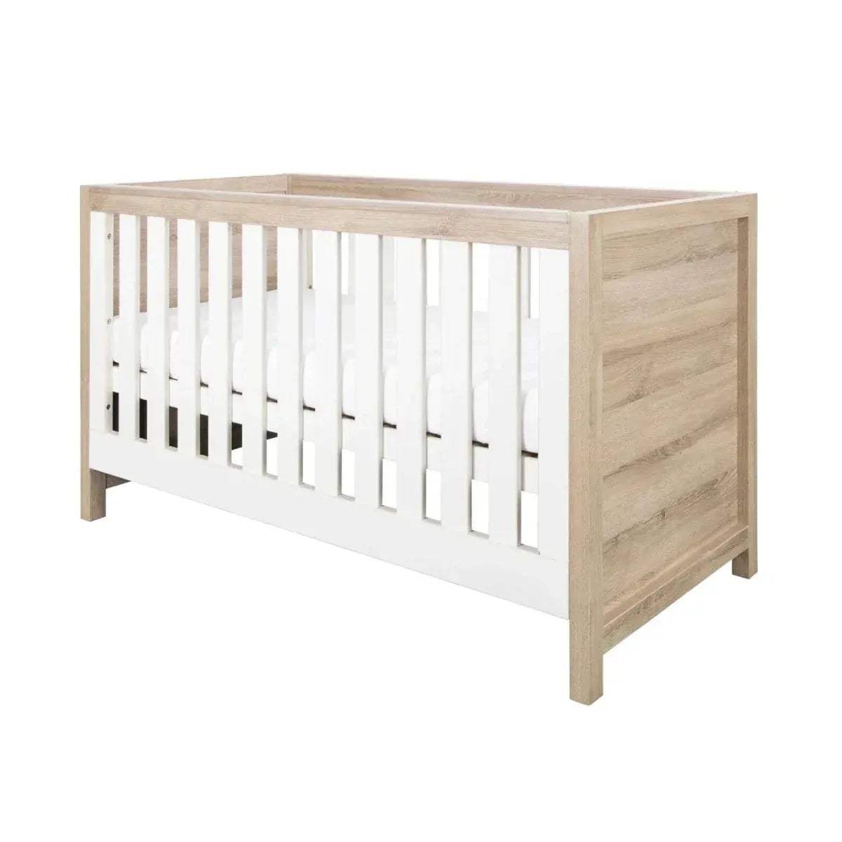 3-in-1 cot bed frame with white vertical slats and light oak sides and legs
