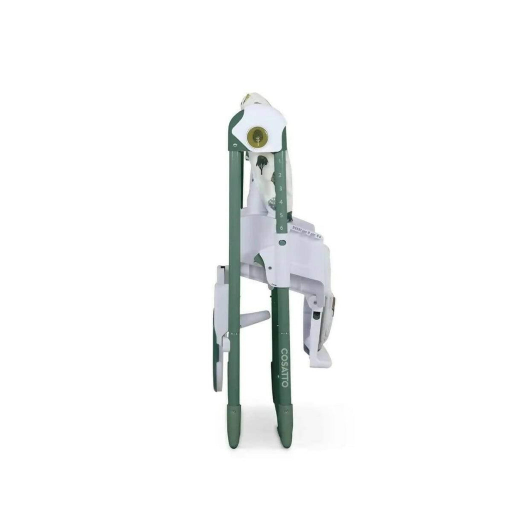 Baby highchair narrow side view with patterned cover and white safety bar, green legs