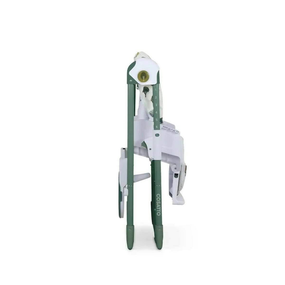 Baby highchair narrow side view with patterned cover and white safety bar, green legs