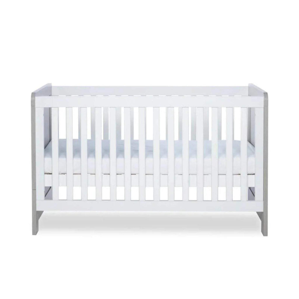 Cot bed interior with white slats and light grey side rails