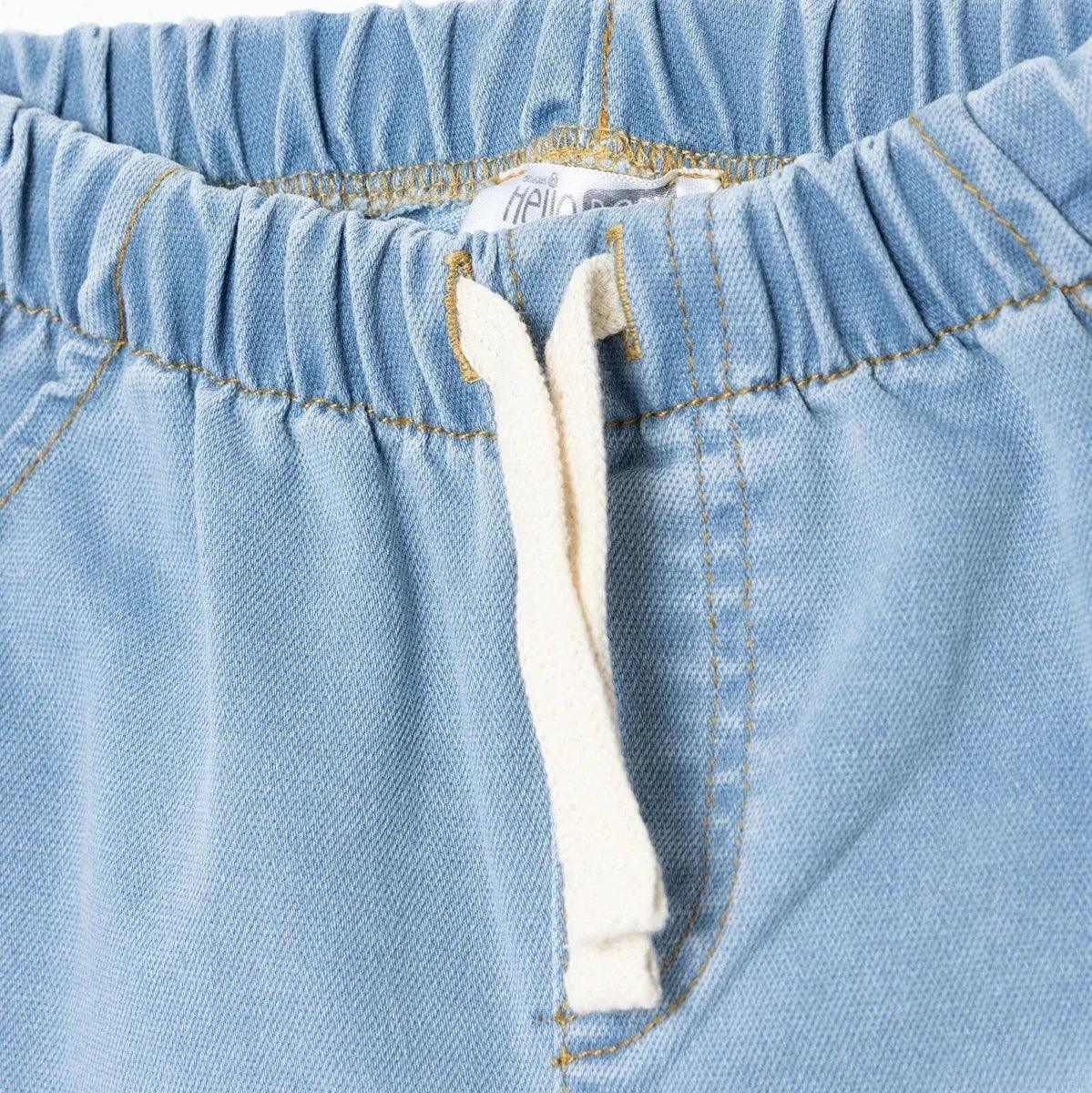 Light blue denim baby trousers drawstring detail at the elastic waistband