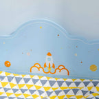 Blue space-themed bed headboard panel with rocket and planet decals
