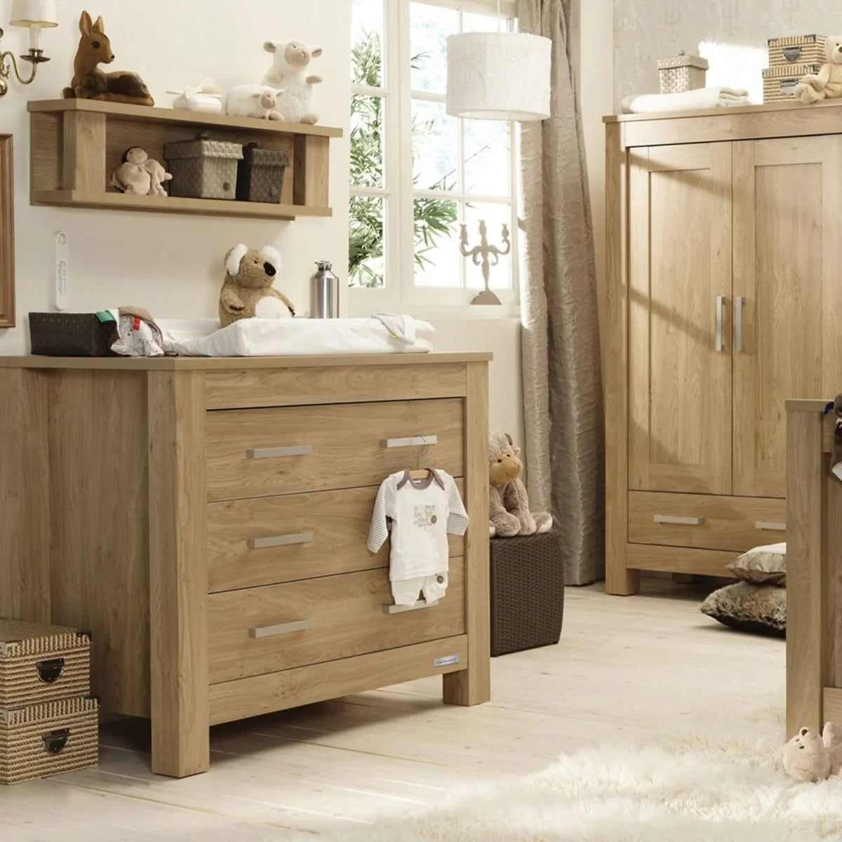 Oak baby dresser with changing top and stacked drawers, silver bar handles