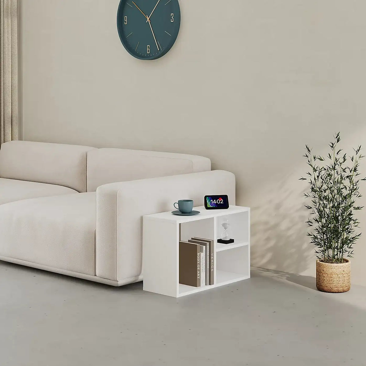 White low standing modular bookcase with open cubby shelves and top ledge