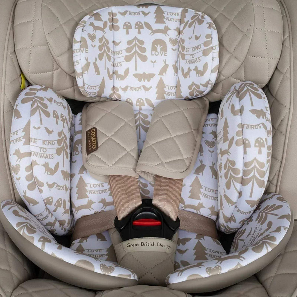 Car seat interior with beige quilting and animal-print seat pad, harness straps visible