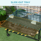 Black bird cage with side-out cleaning tray and metal base on caster wheels