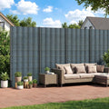Grey privacy screen fence panels forming a tall boundary with rectangular grid