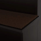 Close-up of brown carpet-covered step on dark brown pet stairs