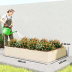 Extra-large wooden raised garden bed planter box filled with orange and yellow flowers