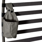 Side pocket attached to egg chair frame in dark gray fabric