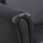 Black kids armchair close-up of upholstered armrest seam and cushion