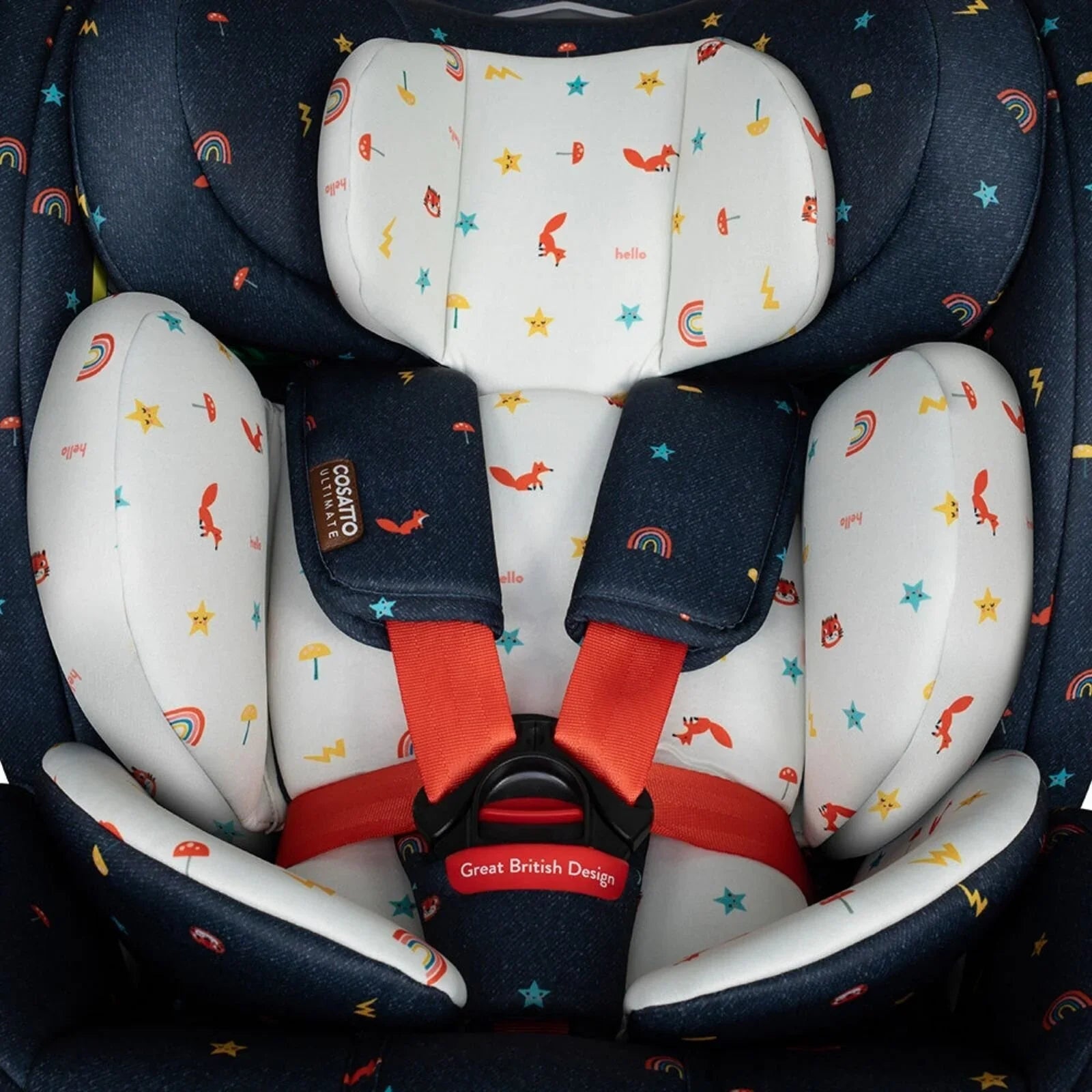 Close-up of navy doodle-pattern car seat harness padding with white patterned insert