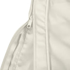 Cream cushion cover close-up showing stitched edge and zipper-style closure