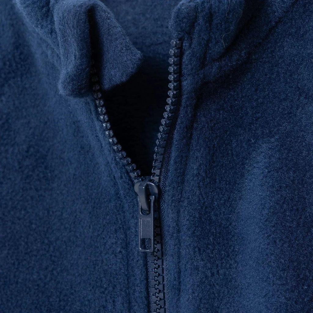 Navy blue fleece gilet close-up of zipper pull
