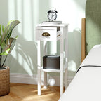 White bedside table with drawer and open shelf, gold arched handle