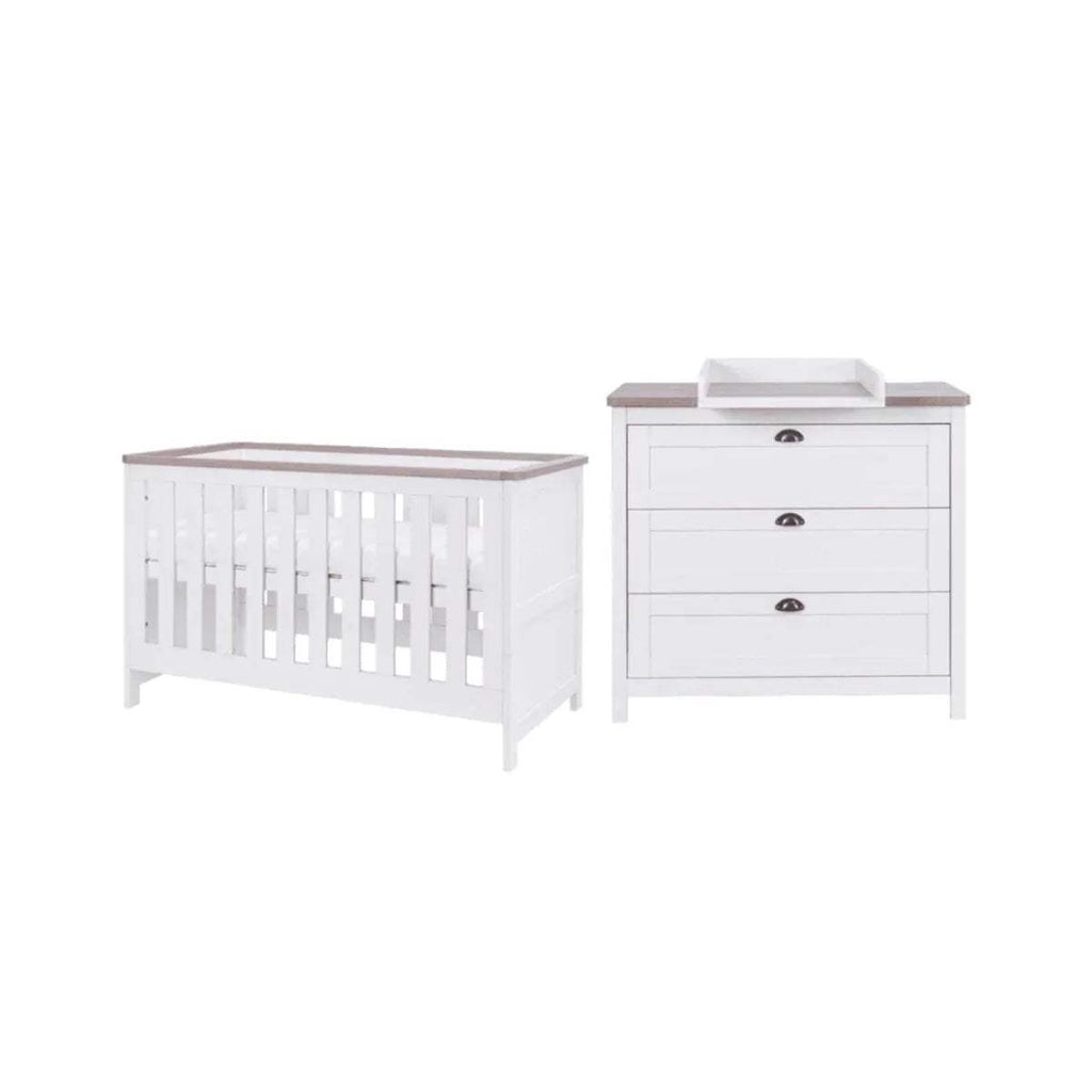 White baby cot and matching dresser with dark metal handles
