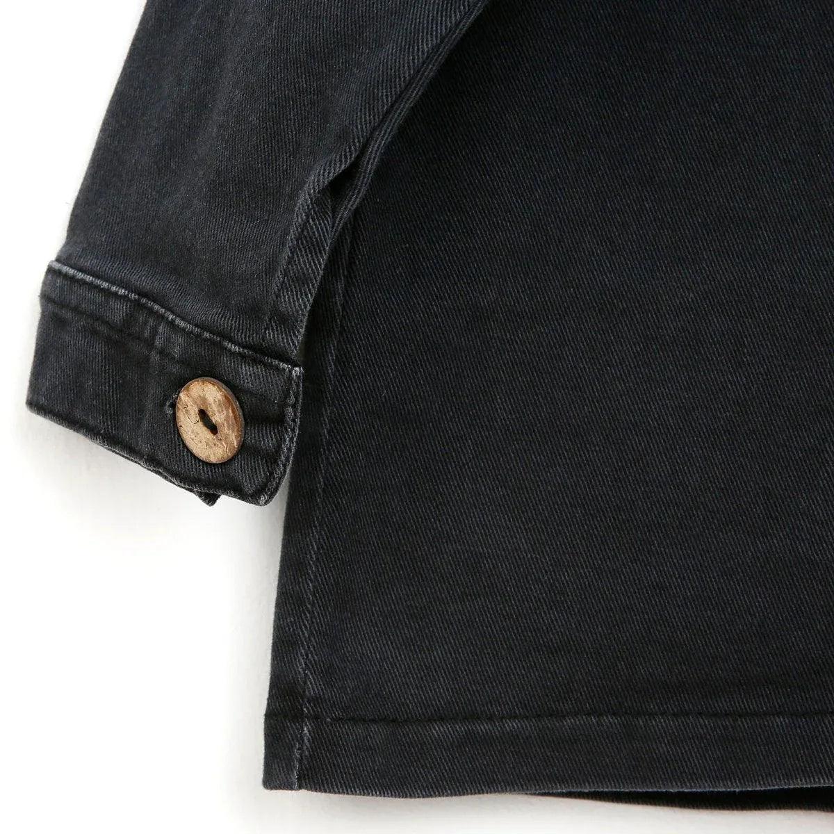 Dark anthracite baby jacket sleeve with button cuff and stitched hem