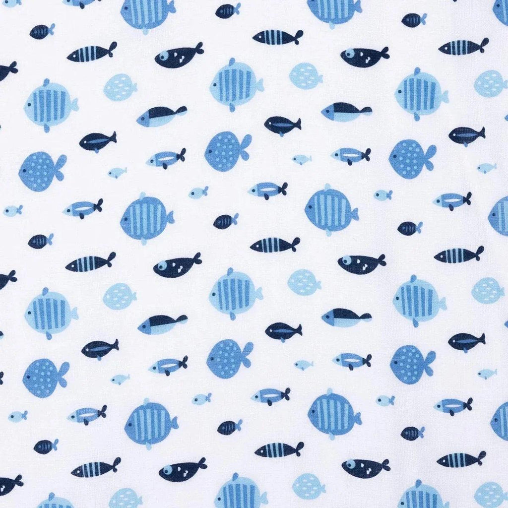 Close-up of blue muslin baby blanket fabric with fish and turtle pattern