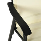 Close-up of beige chair back with black leg frame and support hardware