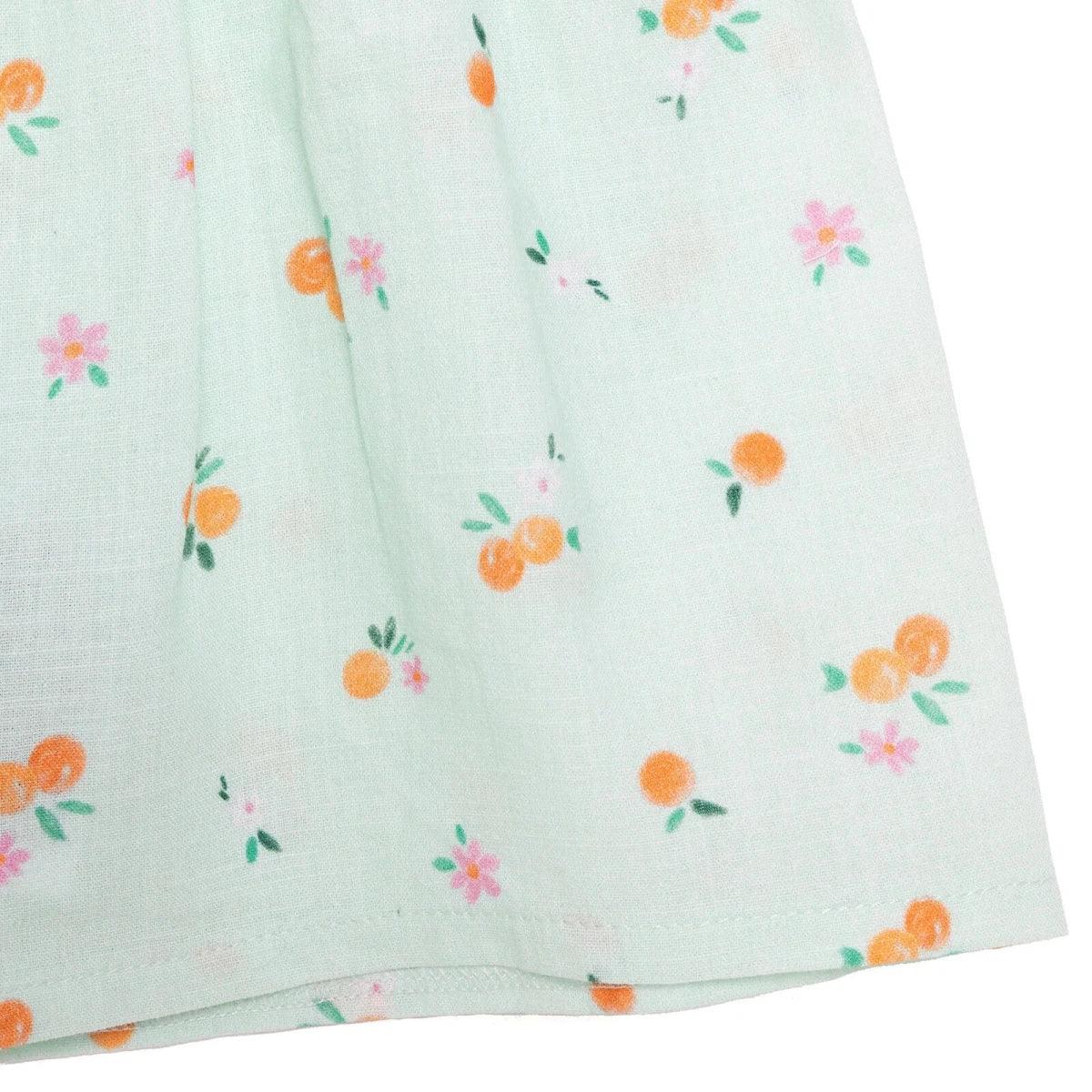 Light blue woven skirt with scattered orange and pink floral pattern