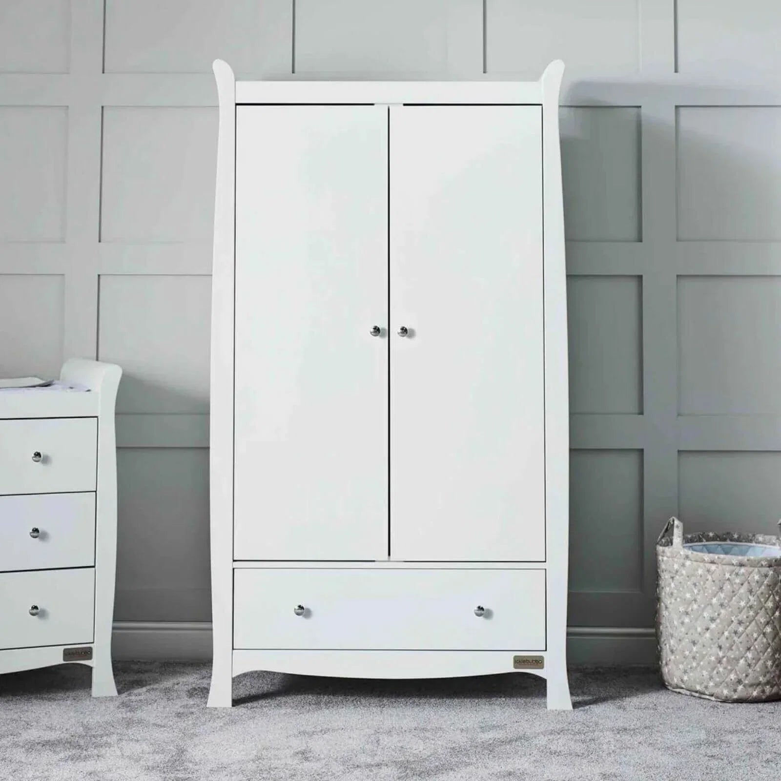 White wardrobe cabinet with two doors and knob hardware on the front