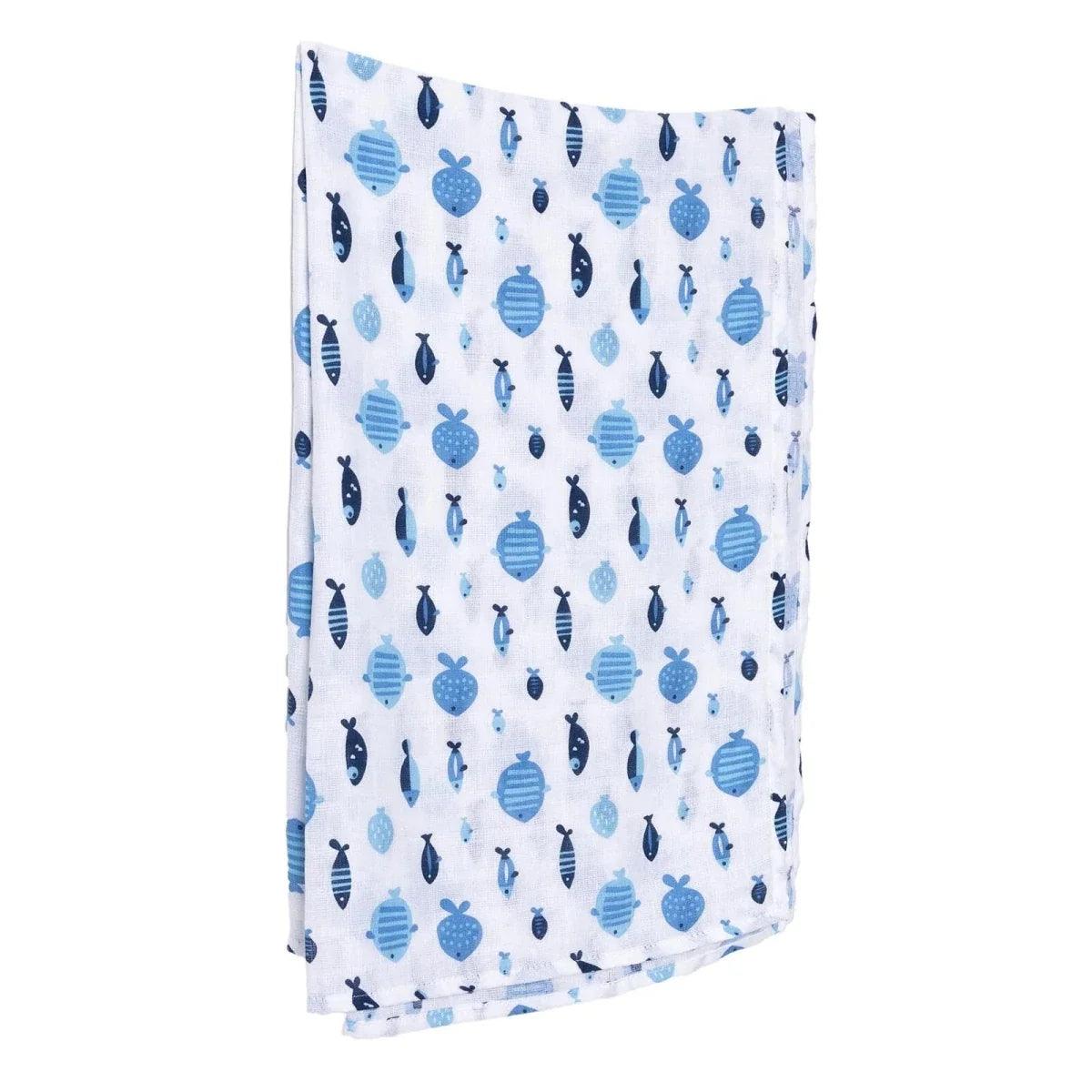 Blue muslin baby blanket folded with repeating fish and turtle print