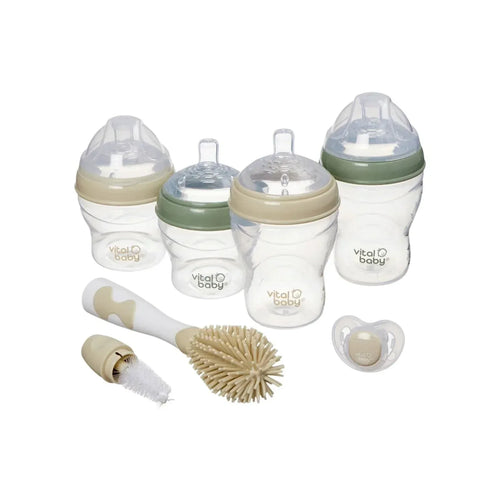 Baby breast-like feeding bottle starter set with brush, pacifier and accessories