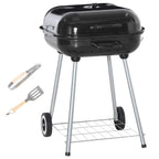 Portable black charcoal grill with lid, wheels, side hooks, and included grilling utensils