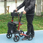 Red rollator walker with black seat, backrest, carry bag, and dual hand brakes