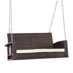 Two-seater hanging rattan swing bench with cream cushion and metal suspension chains