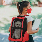 Red rolling pet carrier backpack with black mesh panel and top carry handle