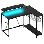 Black L-shaped gaming desk with built-in blue LED light strip and keyboard tray