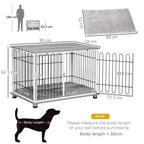 Grey cushioned indoor dog crate end table with open doors, black bar fence
