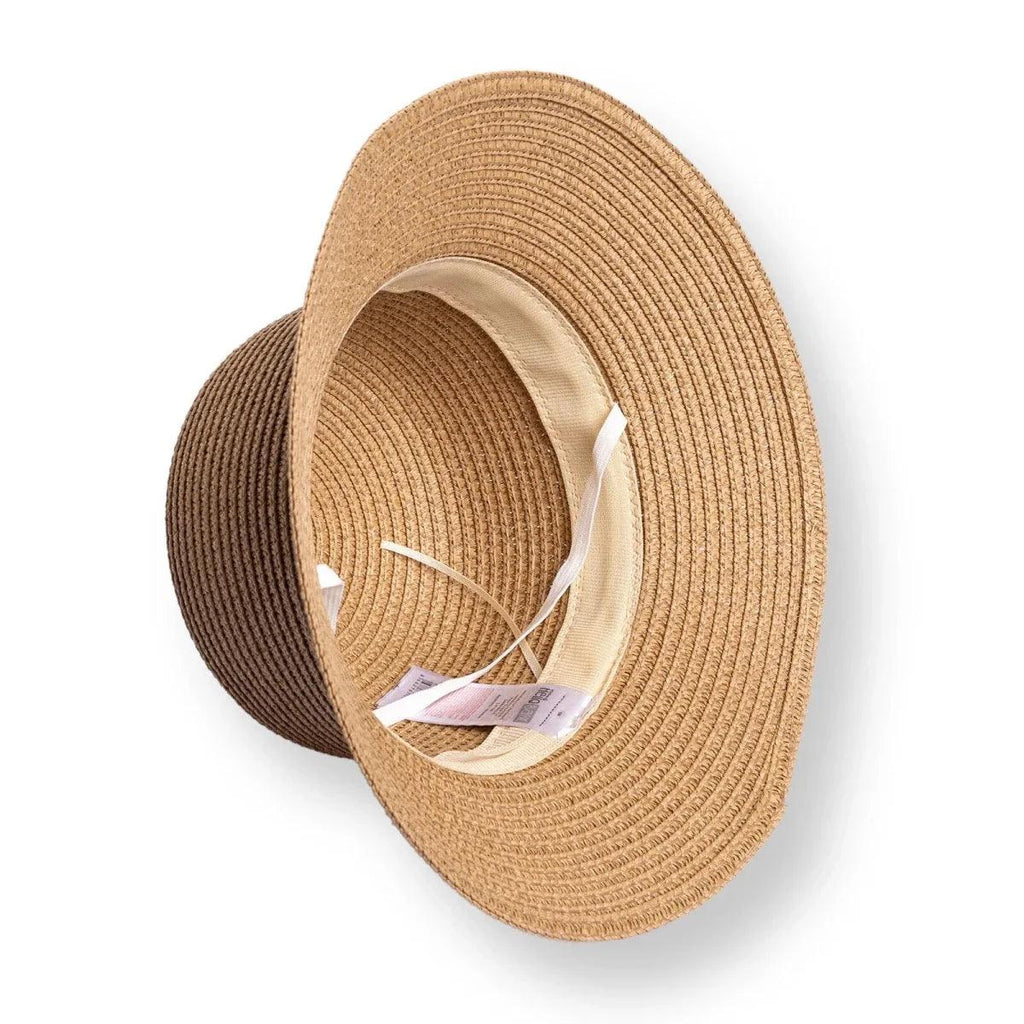 Tan straw bucket hat with pink ribbon bow, open crown showing inner band