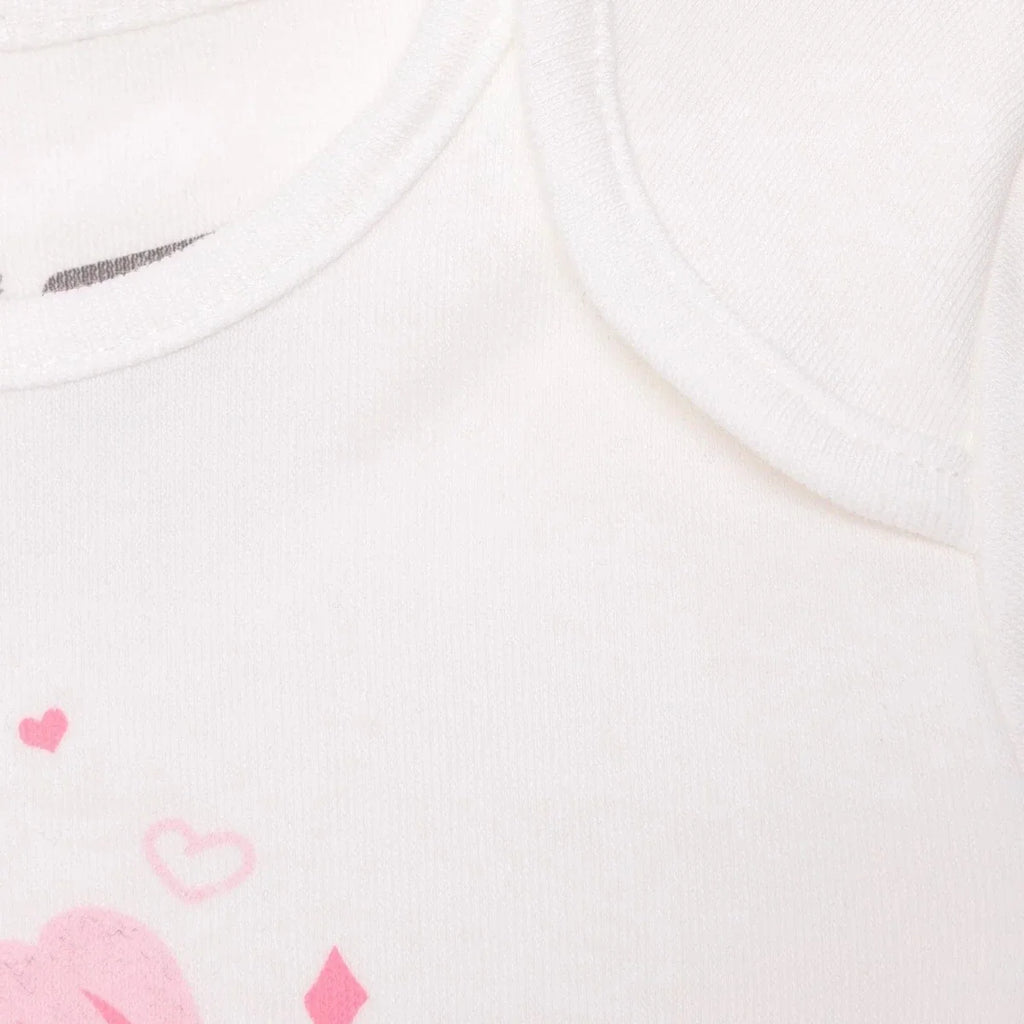 White bodysuit fabric close-up with pink hearts and small tulip graphic