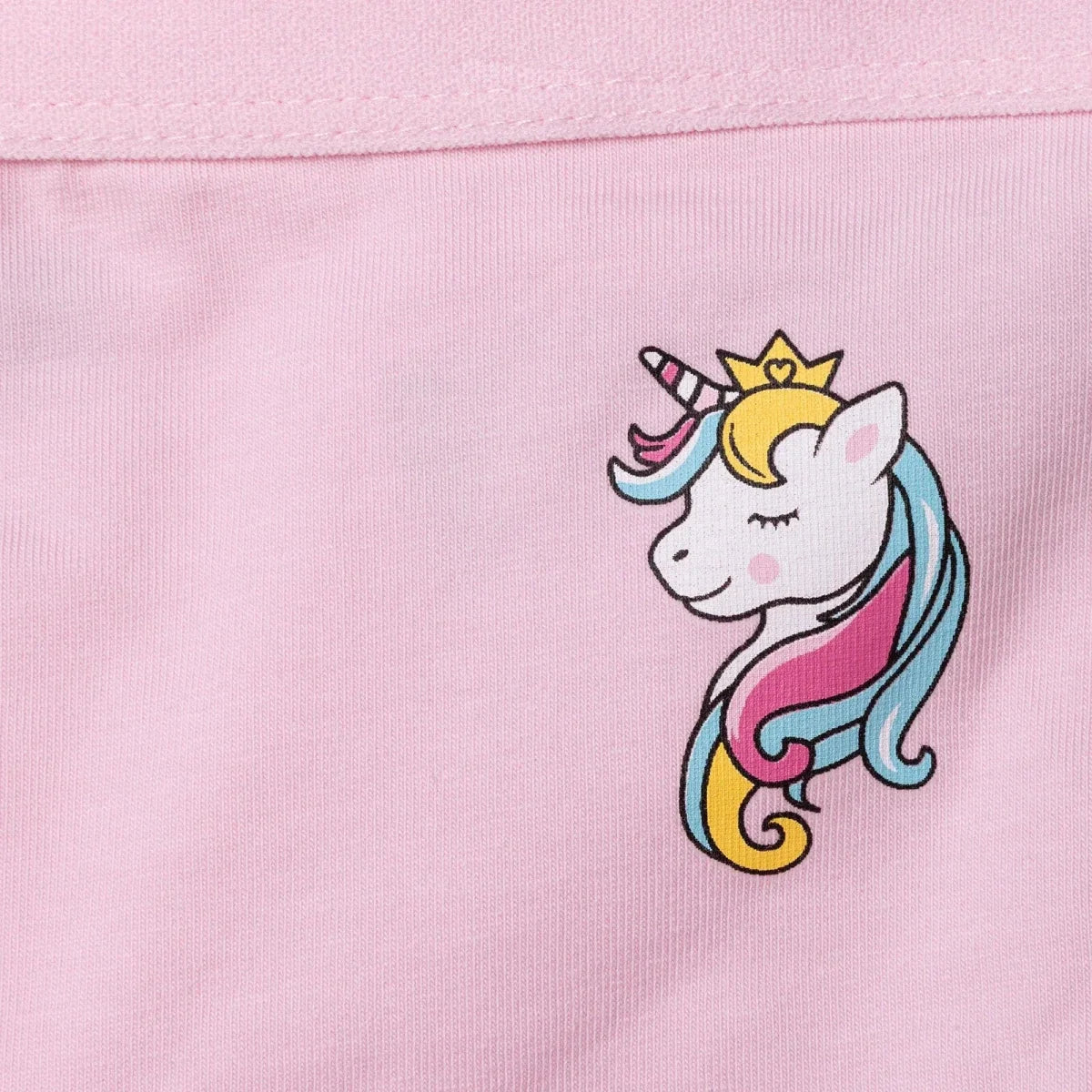 Light pink briefs close-up: unicorn graphic patch on front panel