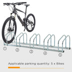 Silver bike parking rack with five numbered slots, holding a black bicycle