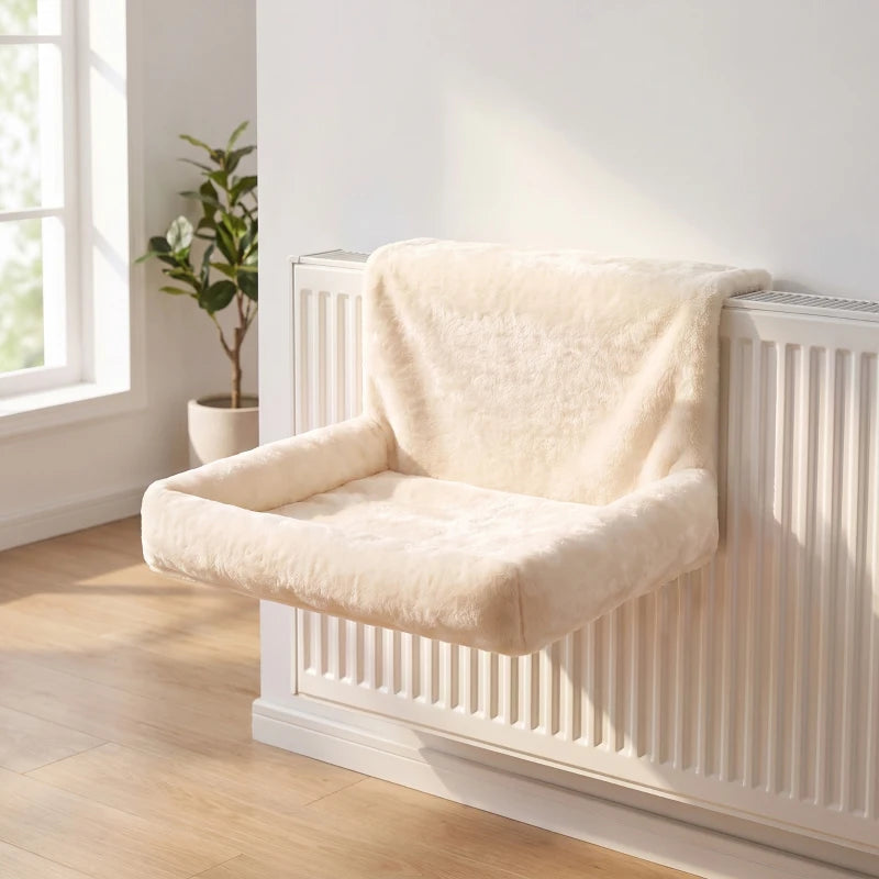 Cream plush cat radiator bed hammock draped on a radiator
