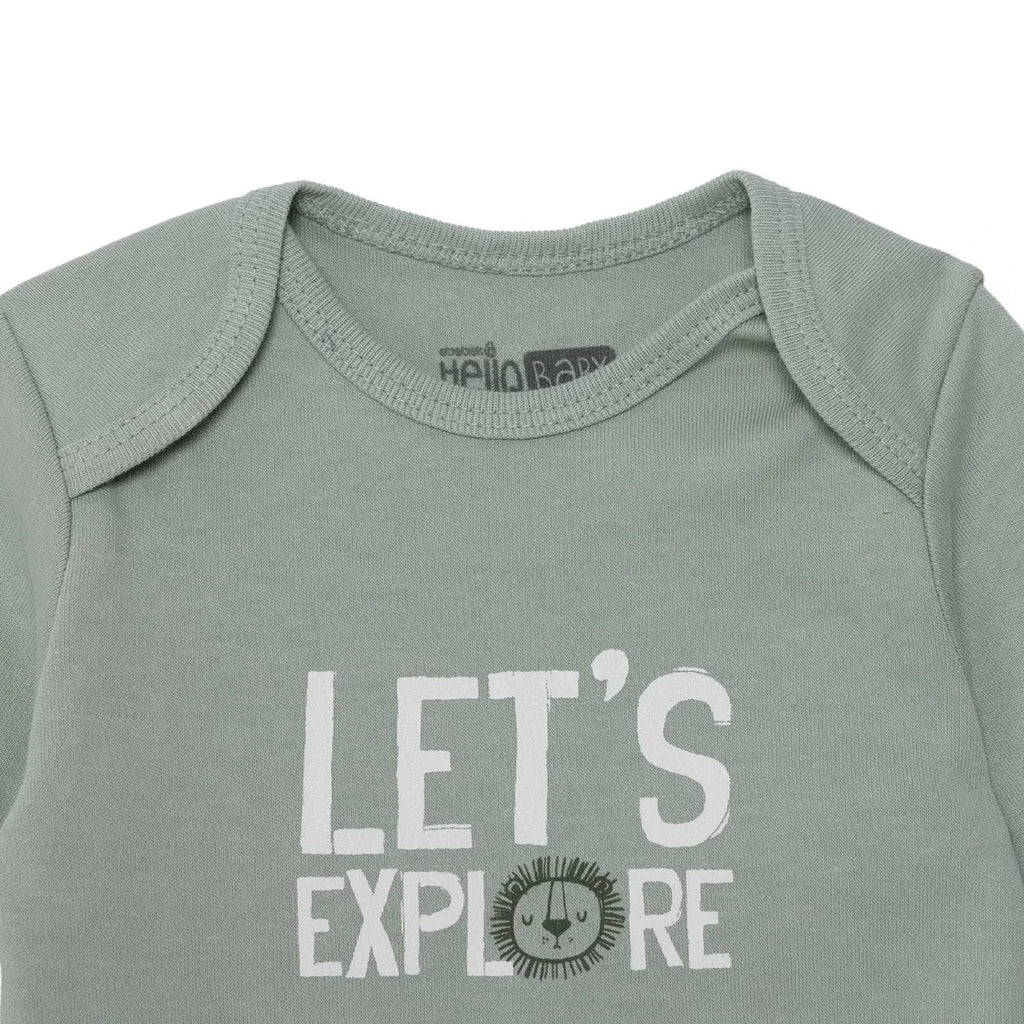 Green long-sleeve bodysuit neckline label with “LET’S EXPLORE” text graphic