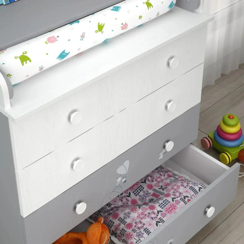 Grey and white changing dresser with open base, patterned pad and front storage drawers