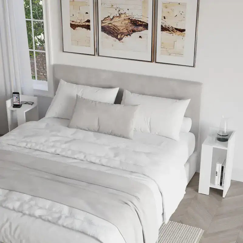 Modern narrow bedside table with open shelf, white finish, left side view.