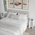 Modern narrow bedside table with open shelf, white finish, left side view.