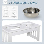 White raised feeding stand featuring two stainless steel bowls