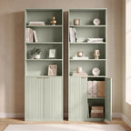 Pair of light green tall bookcases with open cubbies and ribbed panel storage cabinets