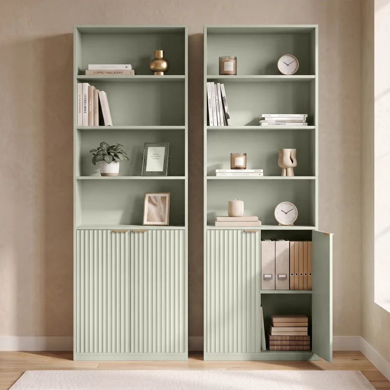 Pair of light green tall bookcases with open cubbies and ribbed panel storage cabinets