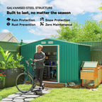 Green metal garden shed exterior with open double doors and ventilation vents