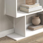 White bookshelf base and lower tiers with a vase and books, open shelf storage