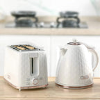 Cream electric kettle and 2-slice toaster on a tabletop
