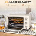 Cream mini countertop oven with open door, interior rack, and baking tray